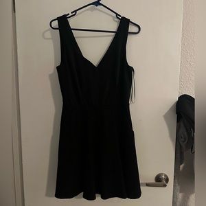 Francesca’s brand black dress with zipper back and pockets. Mi Ami size M